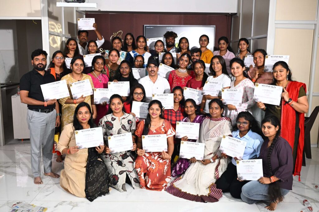 Second Skin Makeup Academy students holding makeup course completion certificates in Hyderabad