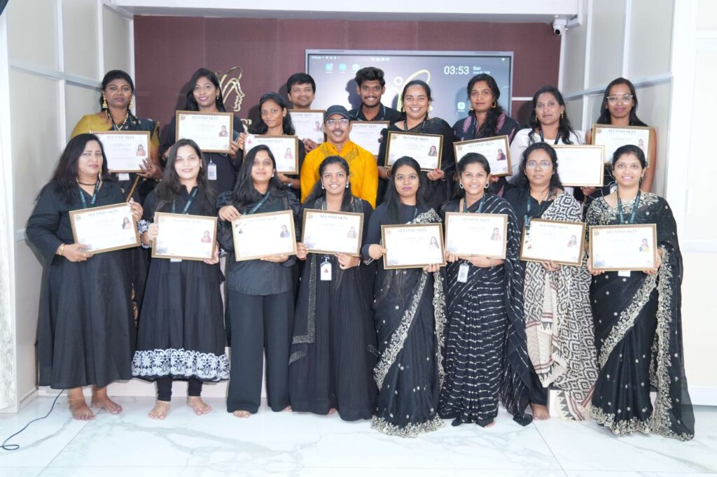 Second Skin Makeup Academy students holding makeup course completion certificates in Hyderabad
