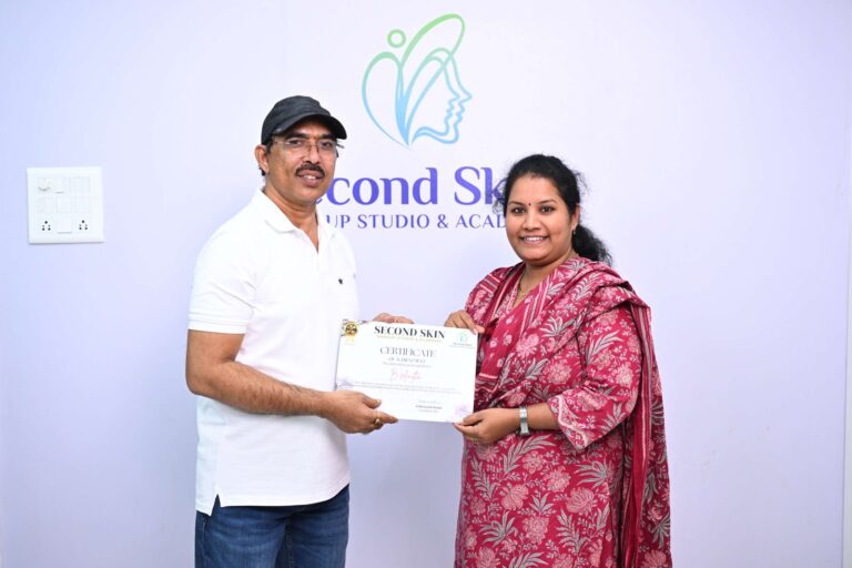 Student receiving a makeup course completion certificate at Second Skin Makeup Academy in Hyderabad