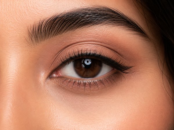 Simple natural eye makeup with soft neutral shadow and a fine liner