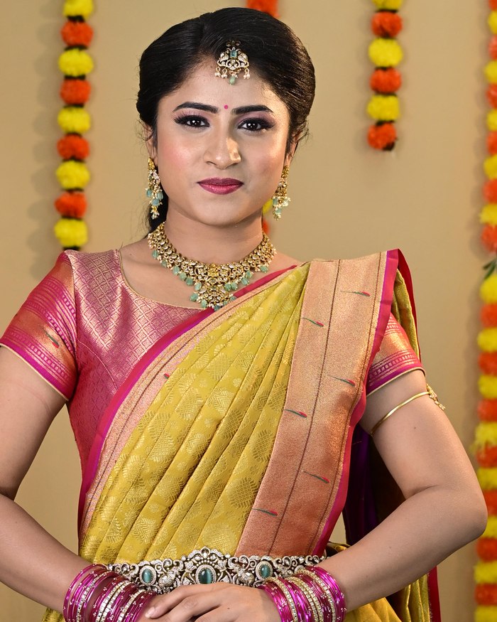 Traditional Kanjivaram saree drape with neat pleats and a pinned pallu