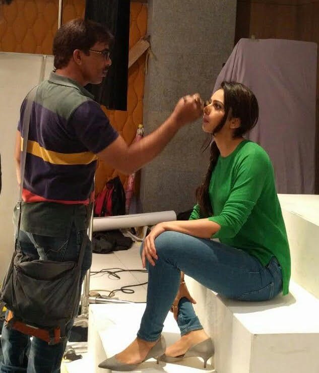Makeup artist working backstage with a professional kit during a shoot in Hyderabad