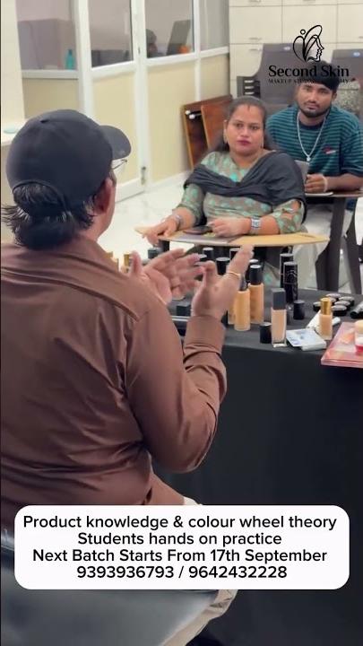 Students practising makeup on live models during a Second Skin Academy class