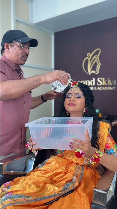 Chakravarthi Kadali demonstrating waterproof makeup on a bridal model